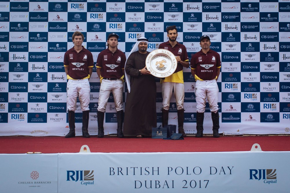Mr Ghazi Al Madani presenting the  plate to to the victorious Bentley Habtoor Polo Team at BPD Dubai- Sam  Churchill-17.jpeg